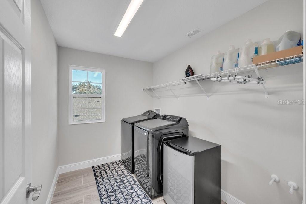 14604 Horse Trot Road Lithia, FL 33547 - Photo 25 of 62 a view of storage and utility room with washer and dryer