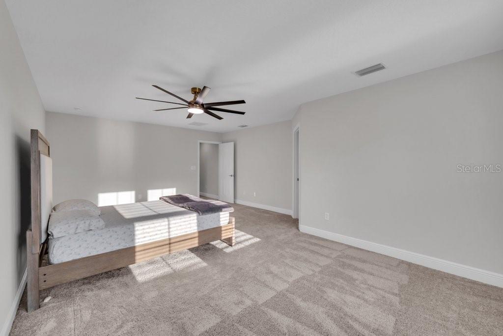 14604 Horse Trot Road Lithia, FL 33547 - Photo 28 of 62 a living room with hard wood floor and a ceiling fan