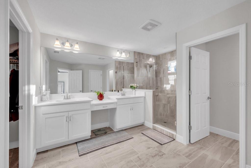 14604 Horse Trot Road Lithia, FL 33547 - Photo 29 of 62 a bathroom with a sink double vanity and mirror