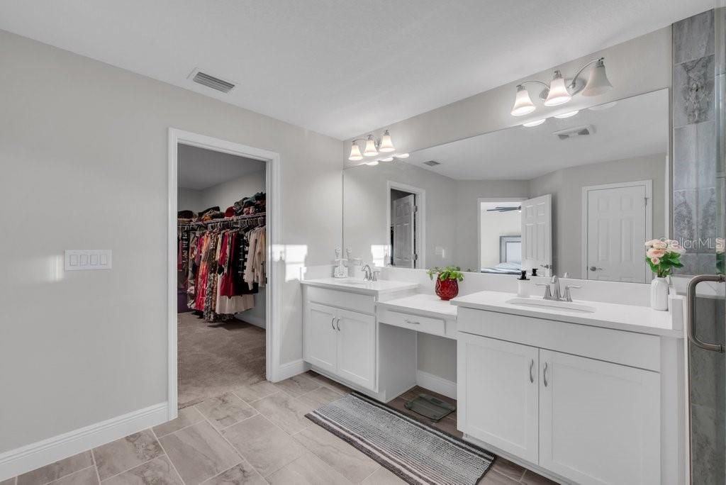 14604 Horse Trot Road Lithia, FL 33547 - Photo 30 of 62 a view of double vanity sink and a mirror