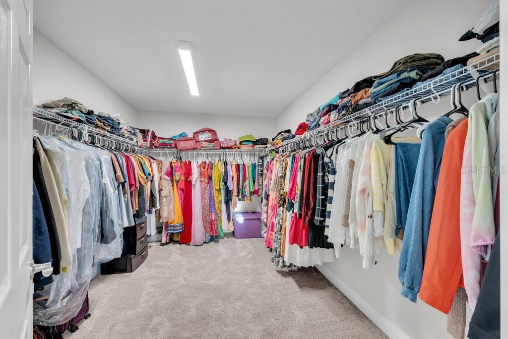 14604 Horse Trot Road Lithia, FL 33547 - Photo 31 of 62 a view of walk in closet with clothes