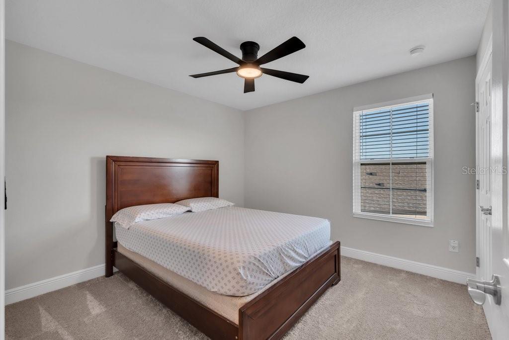 14604 Horse Trot Road Lithia, FL 33547 - Photo 32 of 62 a bedroom with a bed and window