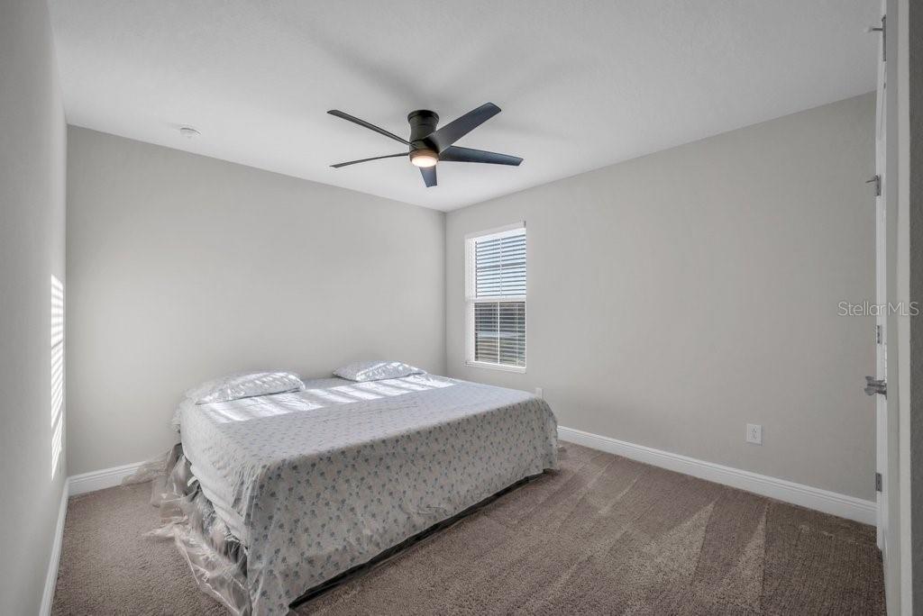 14604 Horse Trot Road Lithia, FL 33547 - Photo 34 of 62 a bedroom with a bed and a window