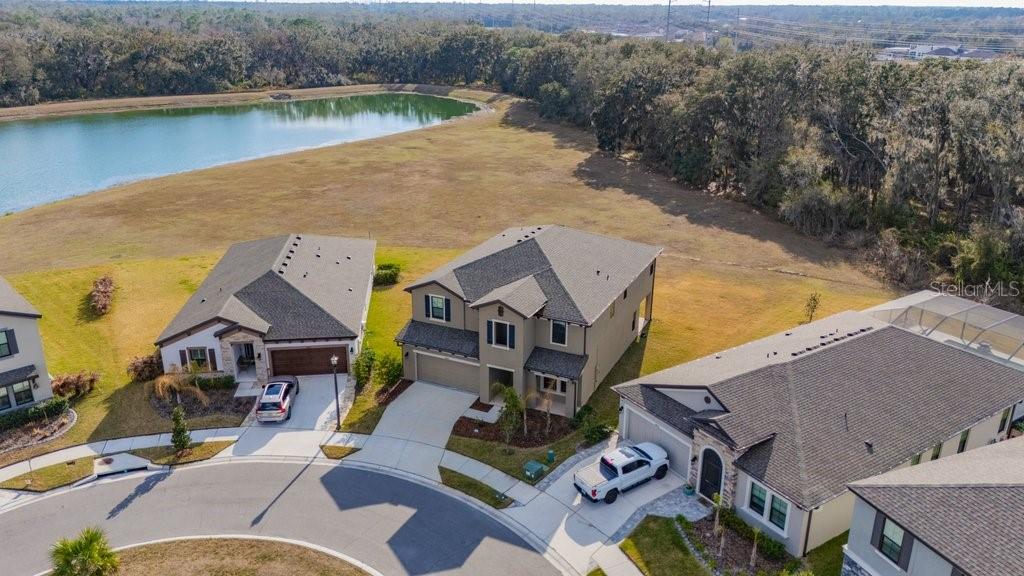 14604 Horse Trot Road Lithia, FL 33547 - Photo 4 of 62 an aerial view of a house with a lake view