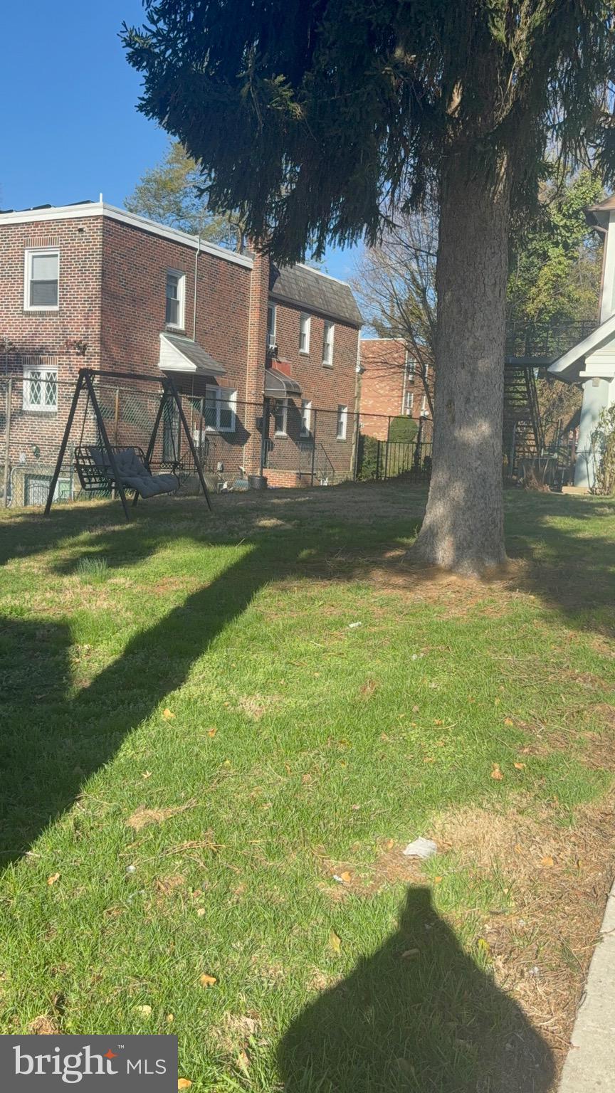820 Vernon Road Philadelphia, PA 19119 - Photo 5 of 6 a view of swimming pool with outdoor seating and a yard