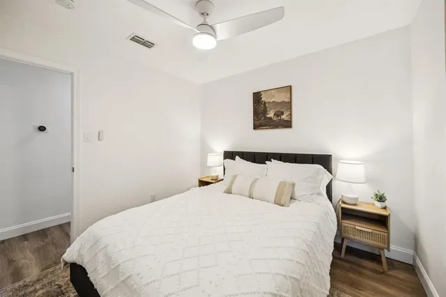 a bedroom with a bed and a tv