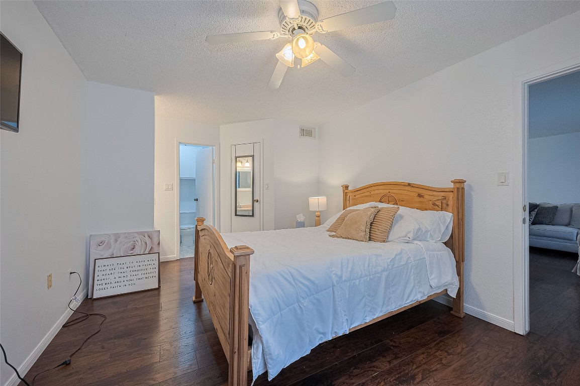 1505 Ward Road, Unit 118 Baytown, TX 77520 - Photo 19 of 35 a bedroom with a bed and a chandelier