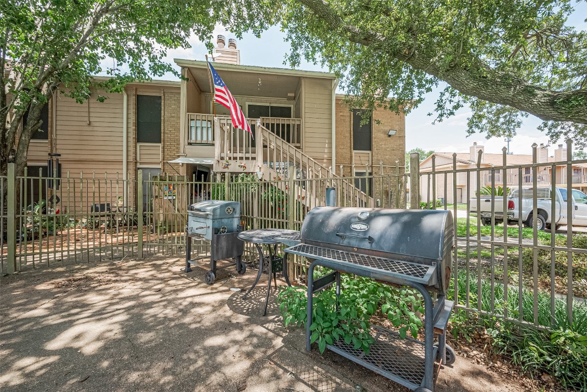 1505 Ward Road, Unit 118 Baytown, TX 77520 - Photo 34 of 35 a view of a chair and table in backyard of the house