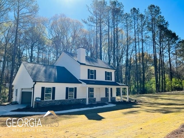 1215 Jackson Lake Road Jackson, GA 30233 - Photo 1 of 1 a view of house with a yard