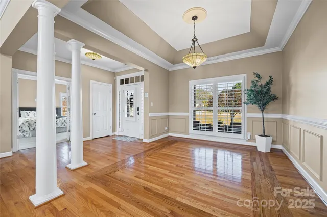 a living room with furniture a fireplace and a ceiling fan