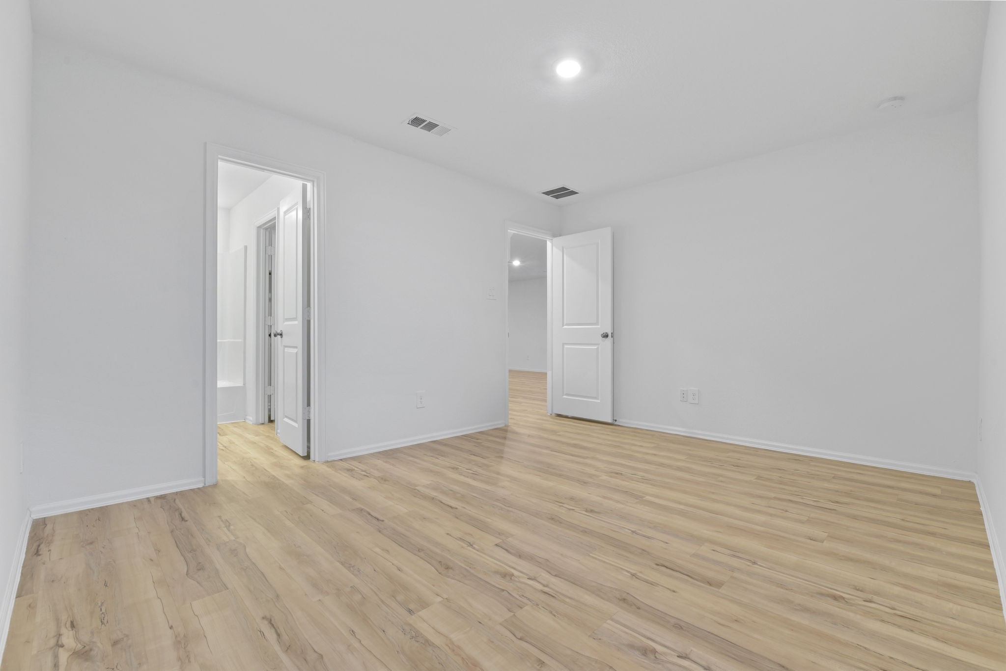 22156 Juniper Crossing Drive New Caney, TX 77357 - Photo 18 of 47 Primary Suite with Door to Living Area in on Right