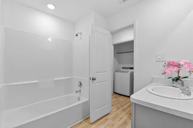 a bathroom with a sink a toilet and bathtub