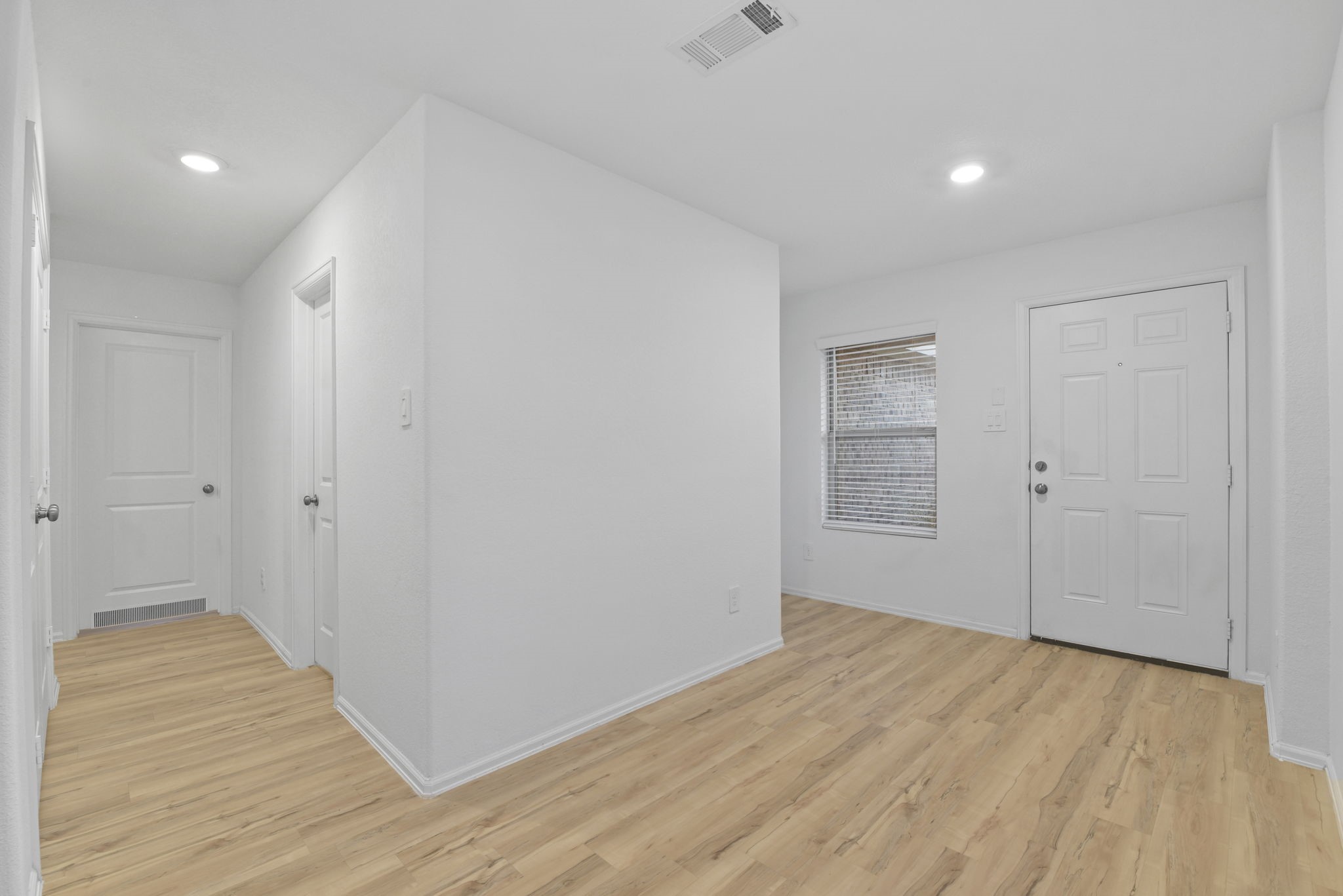 22156 Juniper Crossing Drive New Caney, TX 77357 - Photo 5 of 47 Front door is on the right side and the hallway to the Secondary Bedrooms and Bathroom is on the Left.