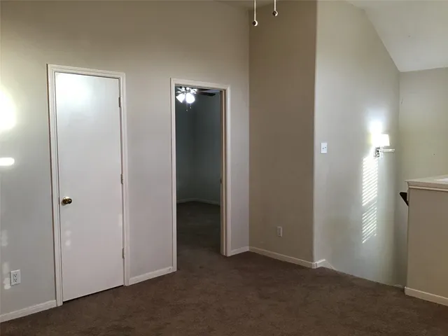 an empty room with closet area