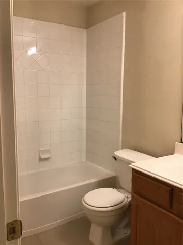 a bathroom with a sink a toilet and a bathtub