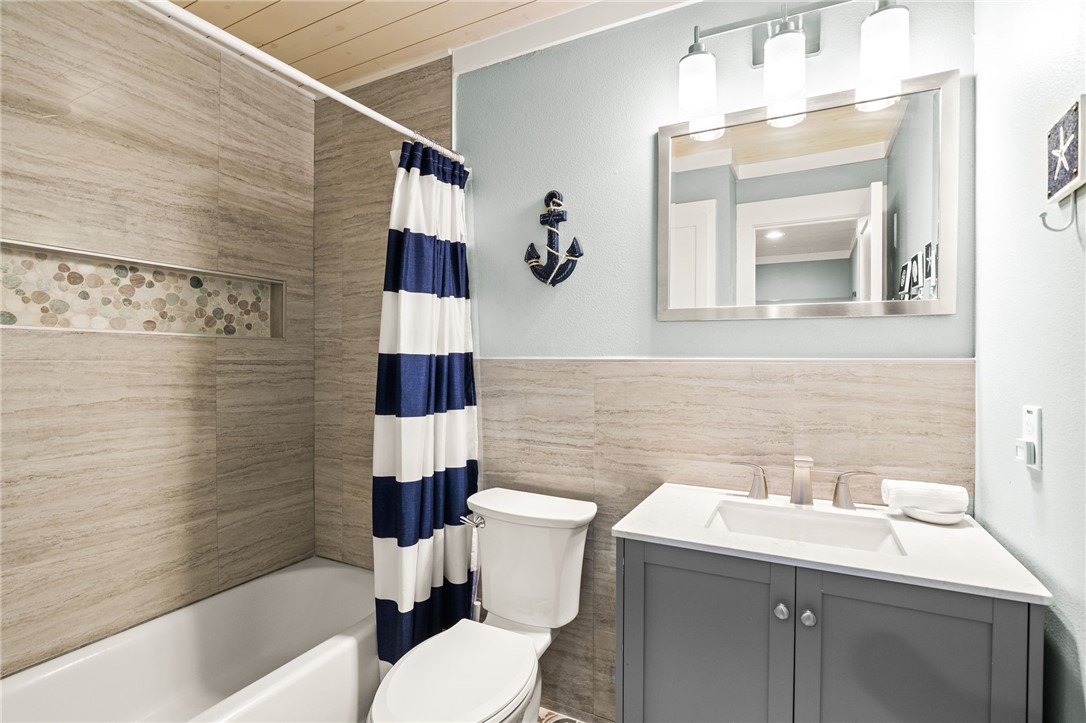 715 Beach Access Road, Unit 1005 Port Aransas, TX 78373 - Photo 13 of 28 a bathroom with a sink toilet and shower