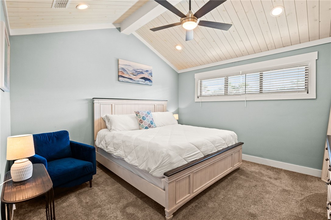 715 Beach Access Road, Unit 1005 Port Aransas, TX 78373 - Photo 17 of 28 a bed room with a bed and a couch