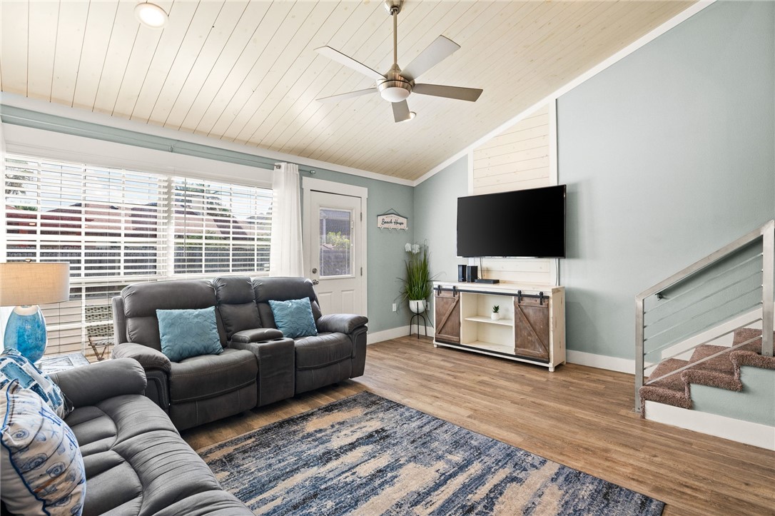 715 Beach Access Road, Unit 1005 Port Aransas, TX 78373 - Photo 3 of 28 a living room with furniture and a flat screen tv