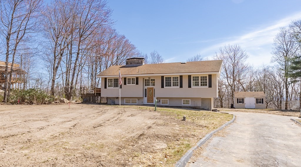 78 Pine Ridge Road Montgomery, MA 01085 - Photo 1 of 42 a front view of a house with a yard covered with snow