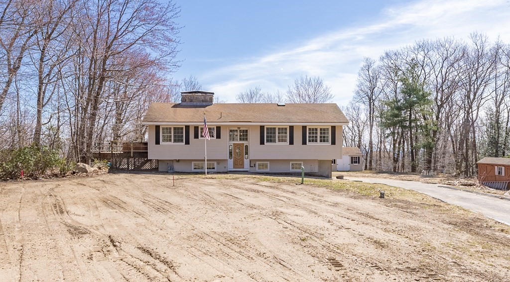 78 Pine Ridge Road Montgomery, MA 01085 - Photo 2 of 42 a view of a white house with a yard covered in snow