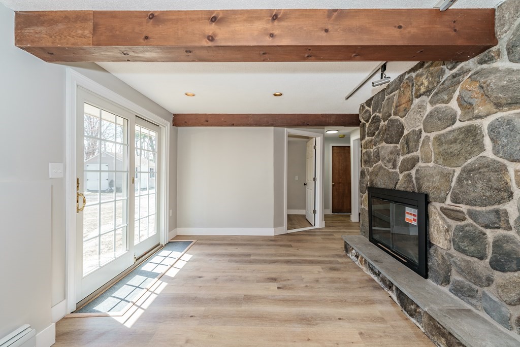 78 Pine Ridge Road Montgomery, MA 01085 - Photo 30 of 42 a view of an empty room with a fireplace