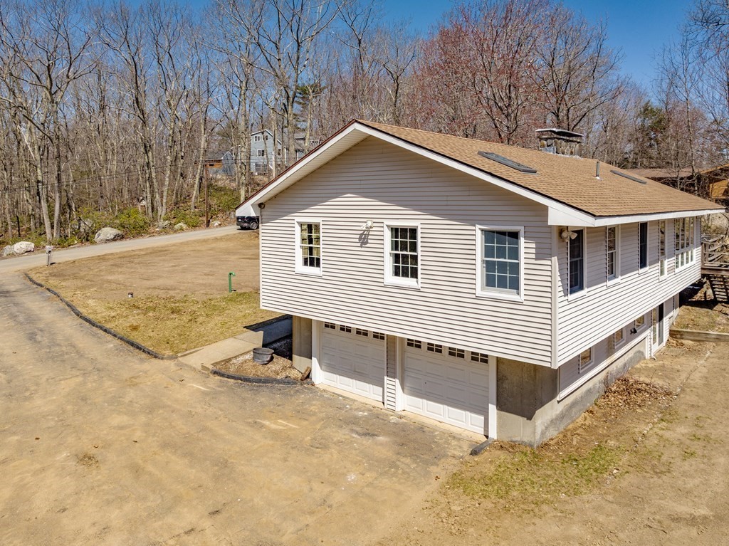 78 Pine Ridge Road Montgomery, MA 01085 - Photo 37 of 42 a view of a house with a yard and garage