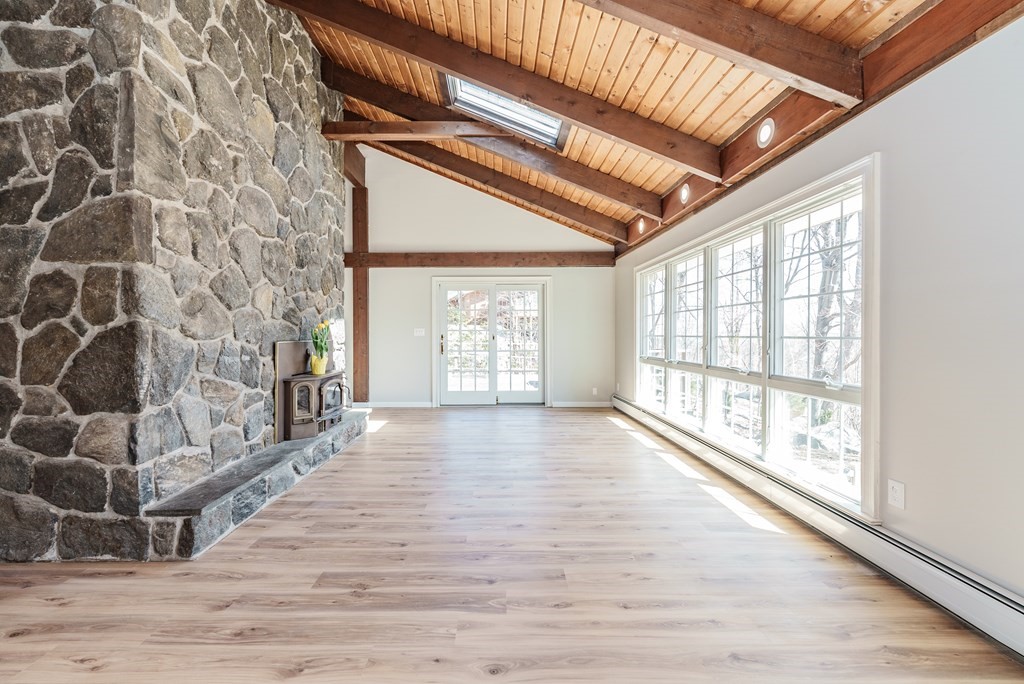 78 Pine Ridge Road Montgomery, MA 01085 - Photo 5 of 42 a view of an empty room with wooden floor and a window