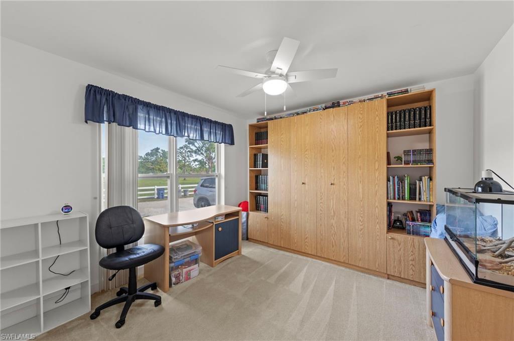 13541 Stringfellow Road Bokeelia, FL 33922 - Photo 18 of 49 a view of a livingroom with workspace and a window