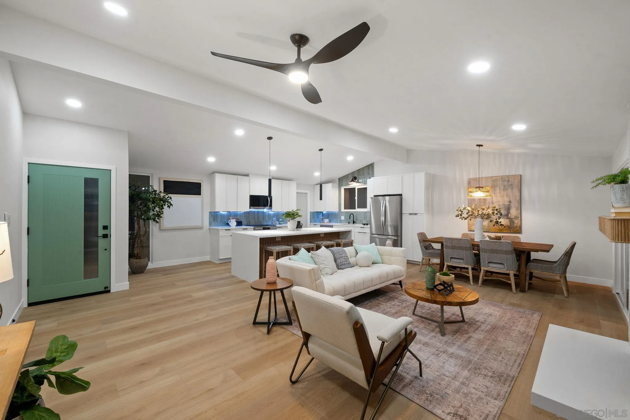 2121 Cardinal Drive San Diego, CA 92108 - Photo 1 of 27 a living room with furniture kitchen view and a wooden floor