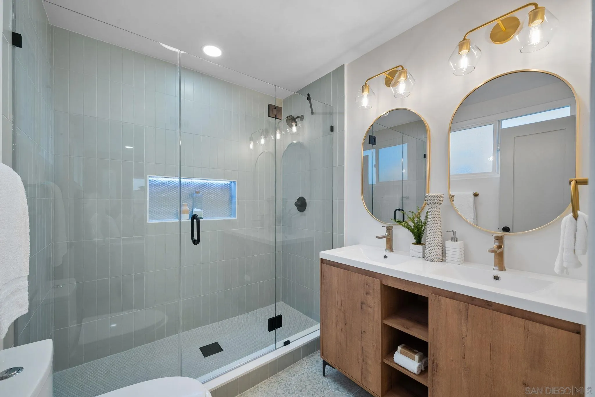 2121 Cardinal Drive San Diego, CA 92108 - Photo 13 of 27 a bathroom with a double vanity sink mirror and shower
