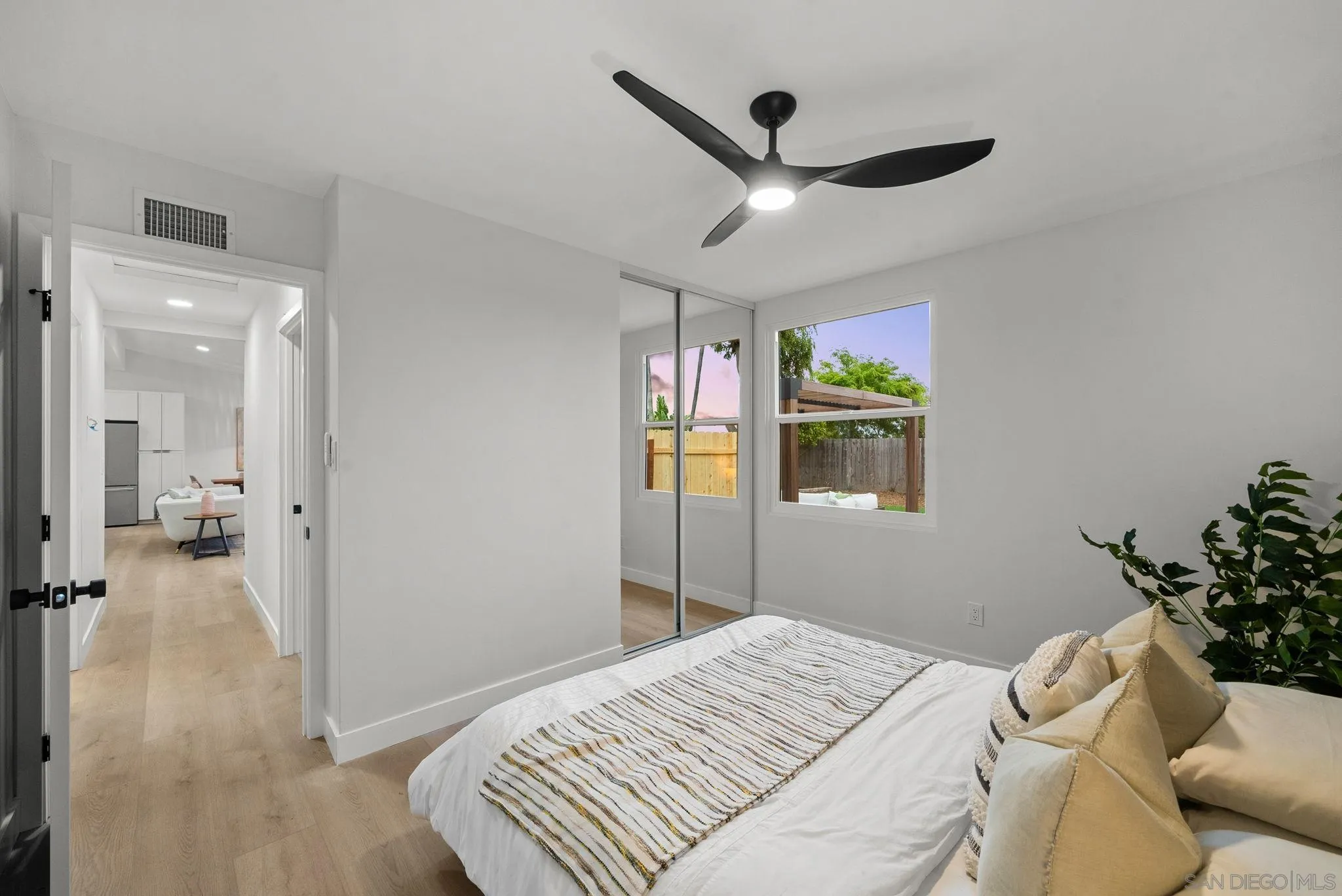 2121 Cardinal Drive San Diego, CA 92108 - Photo 16 of 27 a bedroom with a bed and a chandelier