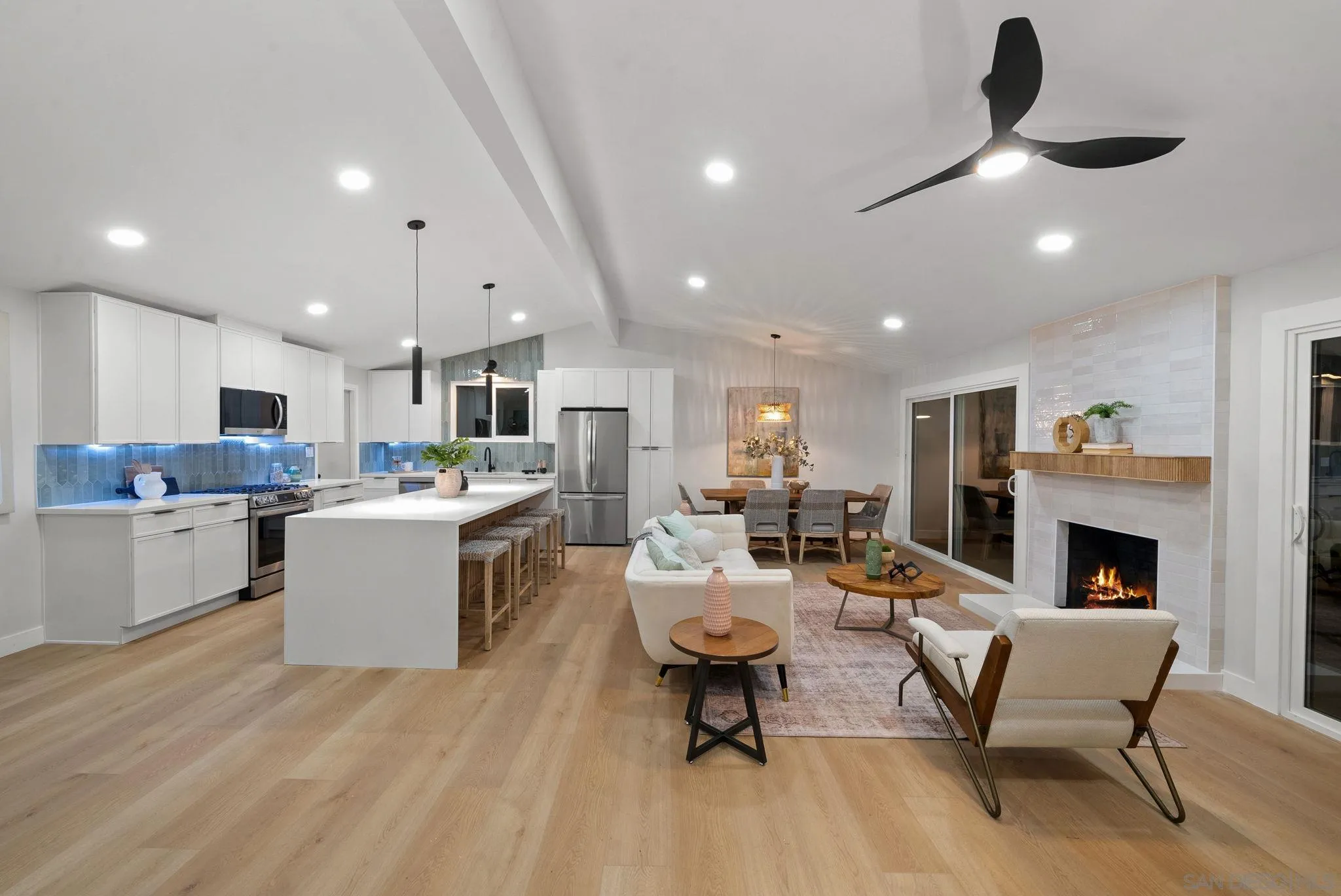 2121 Cardinal Drive San Diego, CA 92108 - Photo 2 of 27 a living room with stainless steel appliances kitchen island furniture and a fireplace