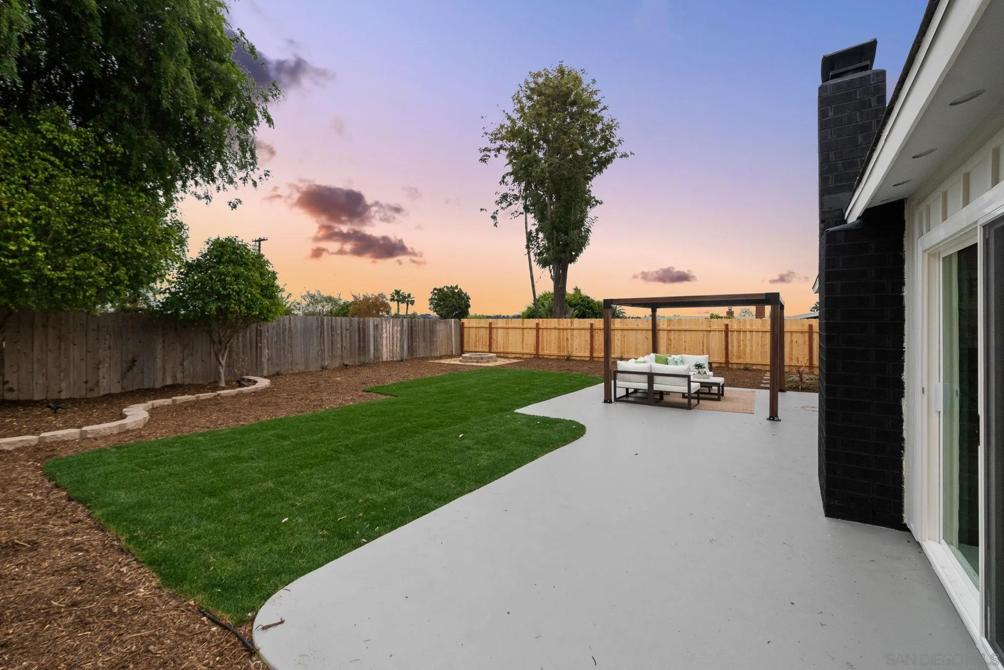 2121 Cardinal Drive San Diego, CA 92108 - Photo 21 of 27 a view of a backyard with seating area and trees