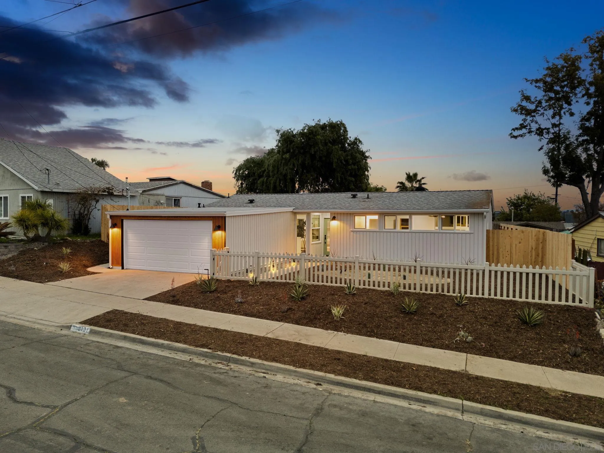2121 Cardinal Drive San Diego, CA 92108 - Photo 26 of 27 a view of a house with a yard