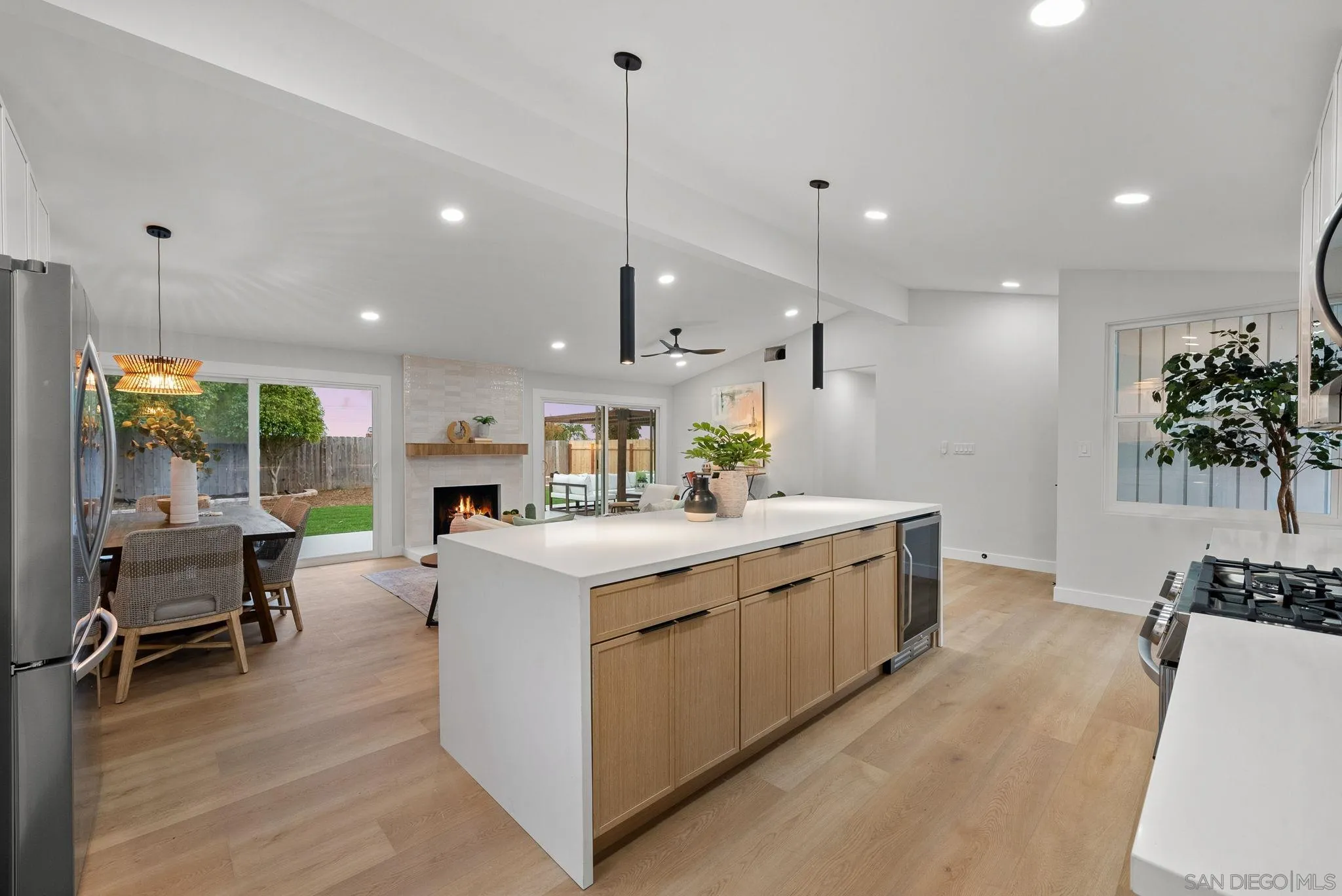 2121 Cardinal Drive San Diego, CA 92108 - Photo 7 of 27 a large kitchen with kitchen island a large island in it
