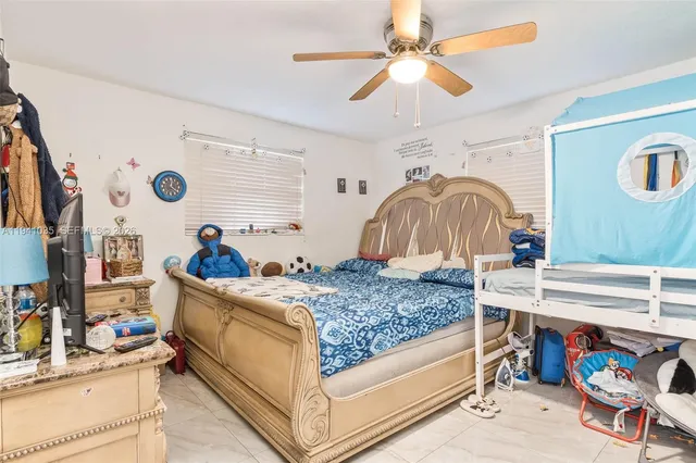 a bathroom with a bathtub shower sink vanity and toilet