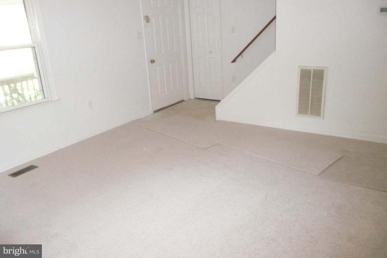 9203 Fort Foote Road Fort Washington, MD 20744 - Photo 6 of 7 Living Room - Stairwell to Upstairs