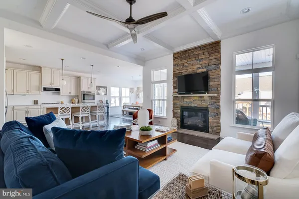a living room with furniture fireplace and a flat screen tv