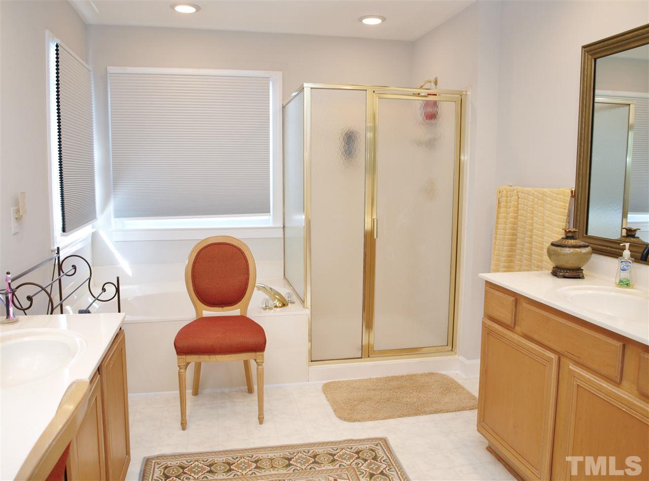 12009 Shavenrock Place Raleigh, NC 27613 - Photo 17 of 30 a bathroom with a sink and a mirror