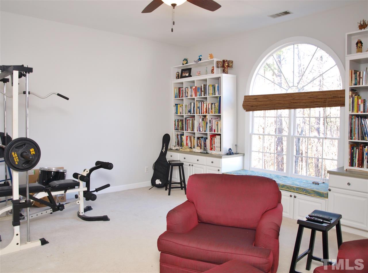 12009 Shavenrock Place Raleigh, NC 27613 - Photo 21 of 30 a view of a livingroom with workspace and a window