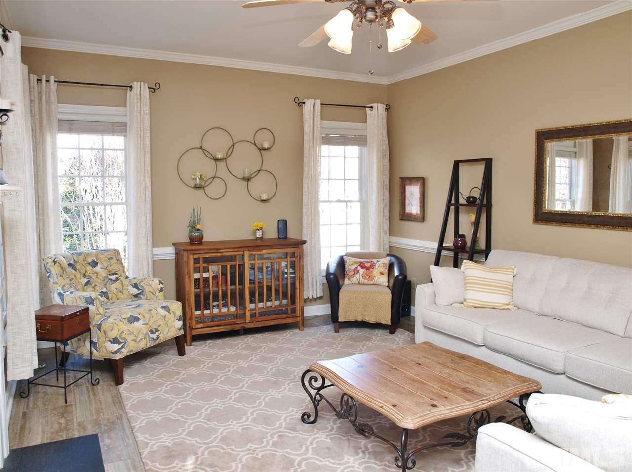 12009 Shavenrock Place Raleigh, NC 27613 - Photo 5 of 30 a living room with furniture and a large window