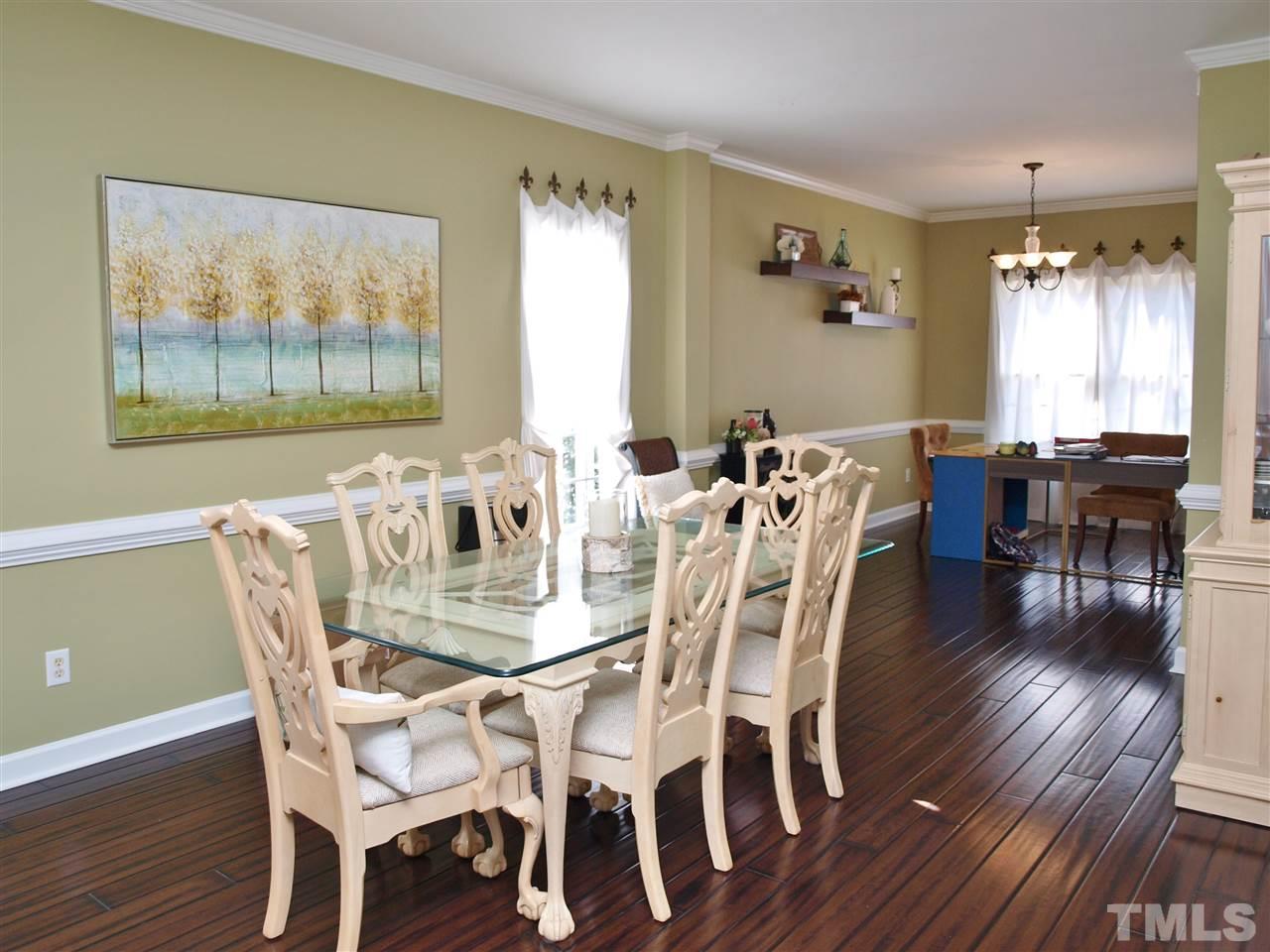 12009 Shavenrock Place Raleigh, NC 27613 - Photo 6 of 30 a view of a dining room with furniture window and wooden floor