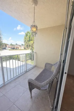 a view of balcony with furniture