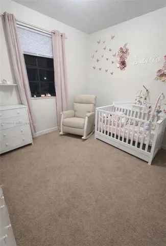 a bedroom with furniture and window