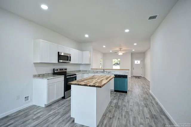 a view of a bathroom with wooden floor