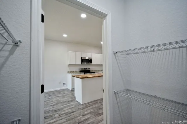 a view of a room with racks on the wall