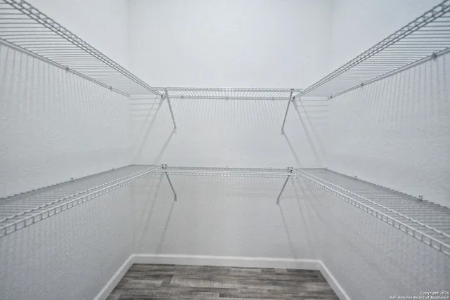 an empty room with closet and window