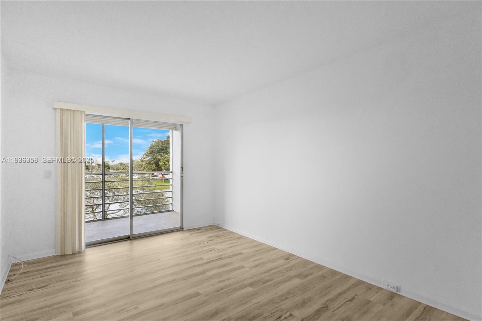 3030 Lincoln B, Unit 3030 Boca Raton, FL 33434 - Photo 15 of 25 wooden floor in an empty room with a window