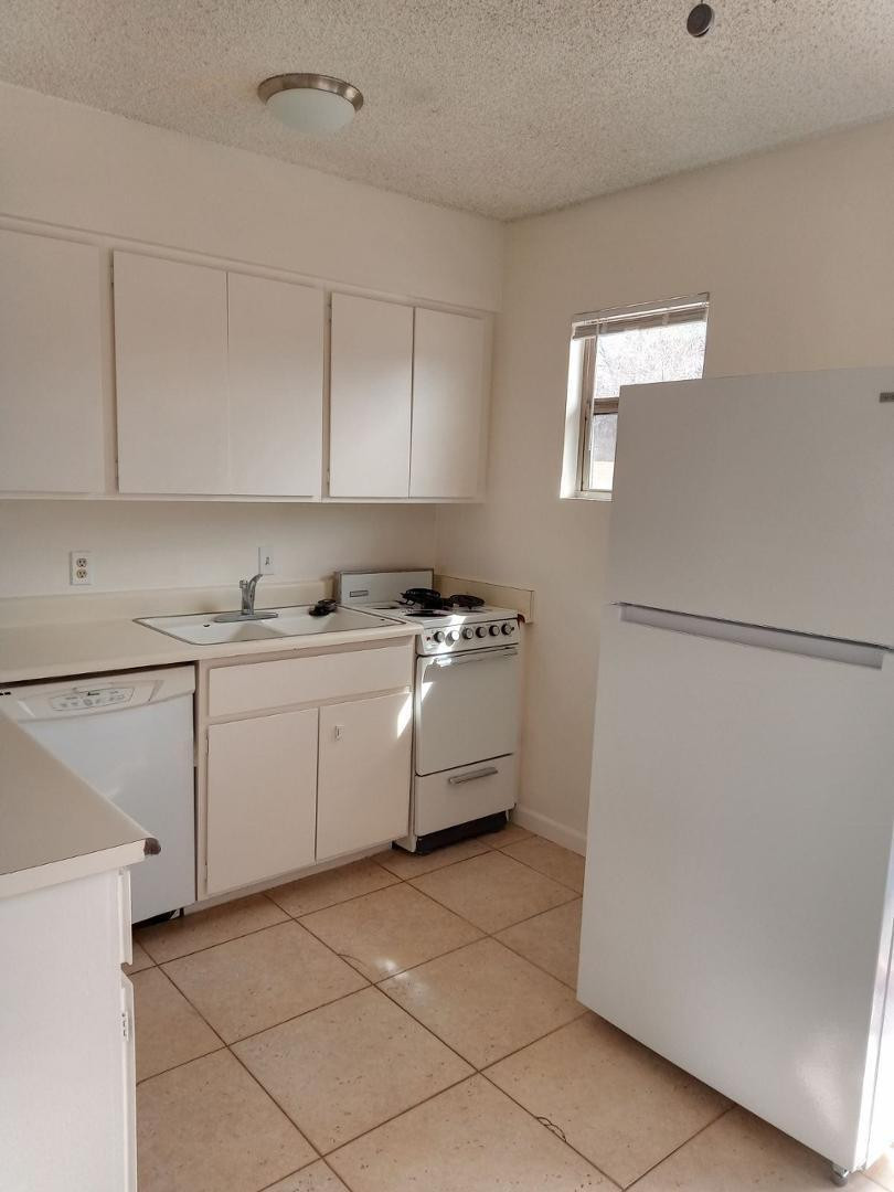 4140 East Cliffside Trail, Unit H Rimrock, AZ 86335 - Photo 8 of 15 a kitchen with a cabinets and white appliances