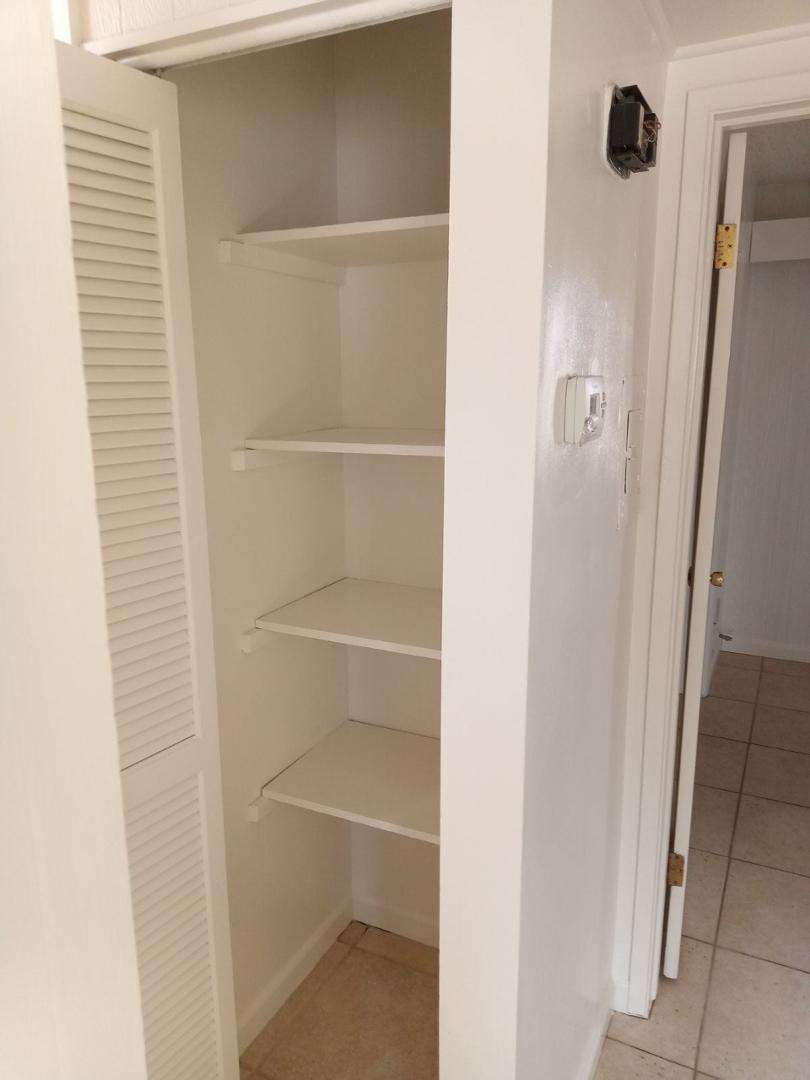 4140 East Cliffside Trail, Unit H Rimrock, AZ 86335 - Photo 9 of 15 a view of walk in closet with empty racks
